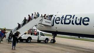 JetBlue flight detects 'fire-like smoke' in cockpit, makes emergency landing as passengers 'freak out'