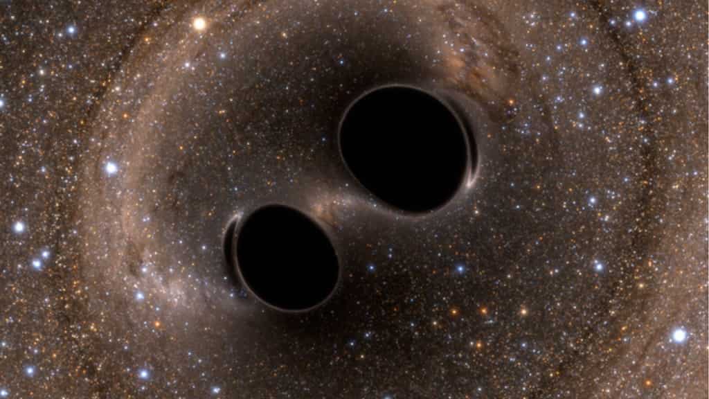 Two galaxies with two black holes each caught in the act of merging by Chandra