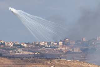 Israel vows to make Iran pay for missile attack, sends more troops to Lebanon