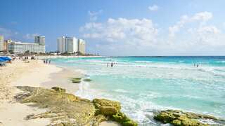 Assassins storm Cancun resort beach, gun down man before fleeing on jet skis
