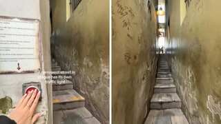 Watch: This is the world's 'narrowest road'. It even has a traffic signal