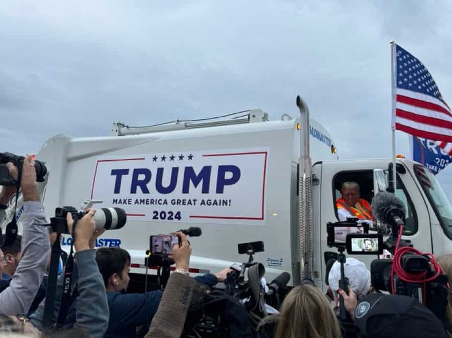 'You are not garbage': Trump rides garbage truck in uniform for supporters at rally in jibe to Biden's remarks