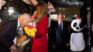 Joe Biden bites a baby as Jill dons a panda suit at their last White House Halloween celebrations