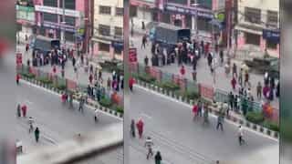 Factory workers protest in Dhaka’s Kachukhet over unpaid wages, set police van on fire