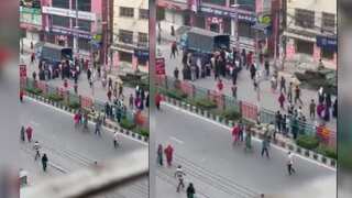 Factory workers protest in Dhaka’s Kachukhet over unpaid wages, set police van on fire