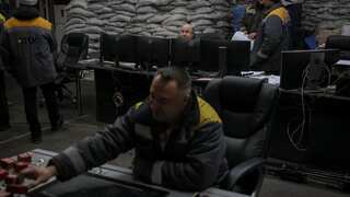 Ukrainian energy workers carry out repairs despite power grid being targeted by Russia