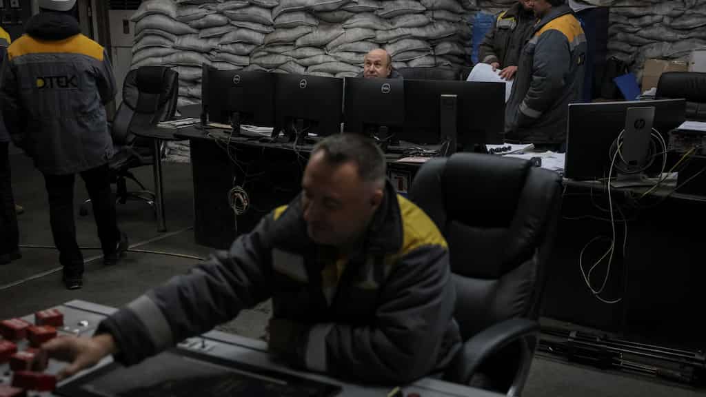 Ukrainian energy workers carry out repairs despite power grid being targeted by Russia