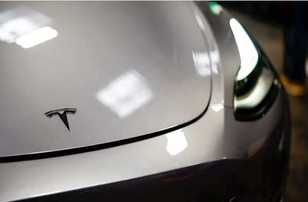 Tesla hits record high as shares soar to USD 415