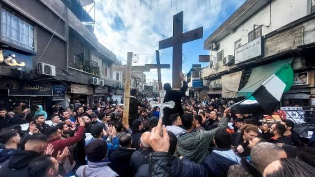 Hundreds hit the streets as protest erupts over burning of Christmas tree near Syria's Hama
