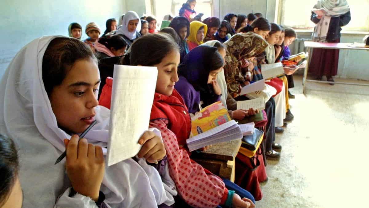 File image of Afghan girls studying a middle school | AFP