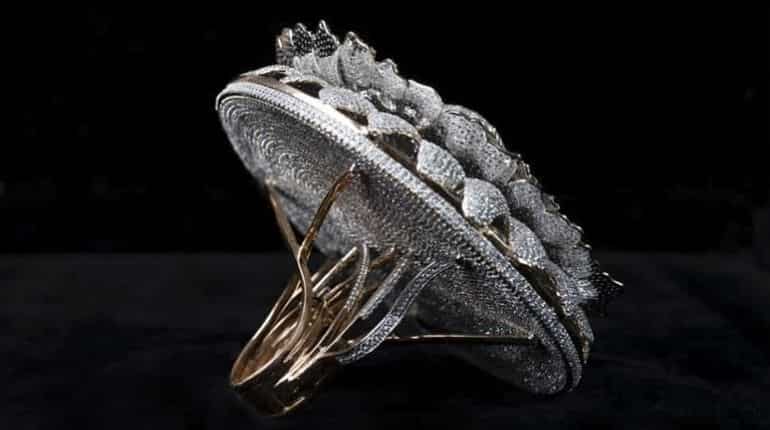 This undated handout photograph provided by the Renani Jewels on December 4, 2020, shows a ring called the Marigold-the ring of prosperity, the circular band with 12,638 diamonds that weighs a little over 165 grams in Meerut. A 25-year-old jeweller in India has become a Guinness World Record holder for designing a ring with the most number of diamonds.