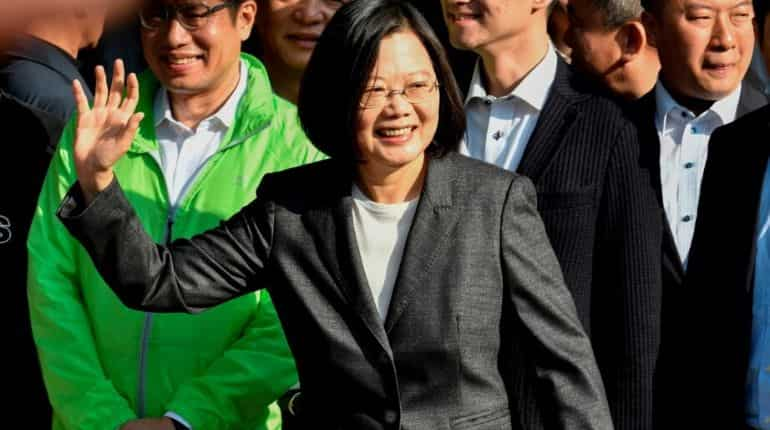 Taiwan President Tsai Ing-wen waves after voting at a polling station in Chunghe district, New Taipei City