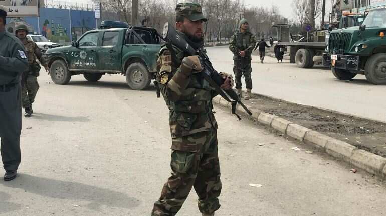 Afghan security forces keep watch near the site of an attack in Kabul