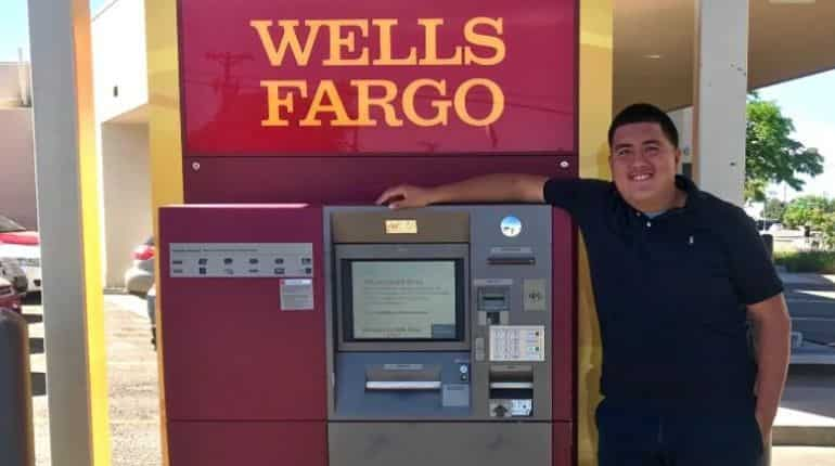 Nunez stands by the ATM where he found the bag.