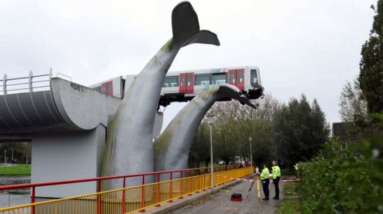 A general view of a metro that crashed through a stop block and landed on an artwork of a whale tail at De Akkers subway station in Spijkenisse, near Roterdam, Netherlands November 2, 2020