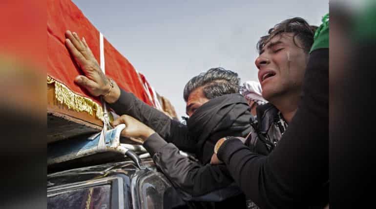 A mourner cries during the funeral of Iraqi paramedic Janat Madhi Hussein