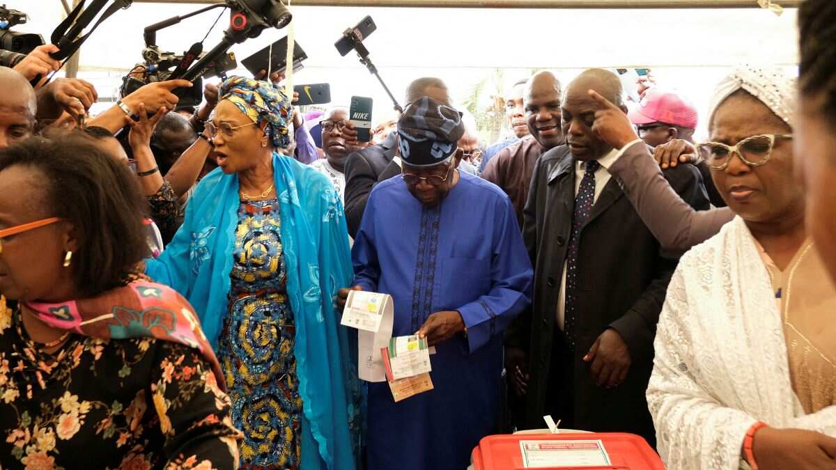 Nigeria's ruling party candidate Bola Ahmed Tinubu and his wife Oluremi Tinubu cast their ballots. 