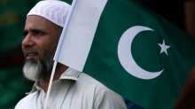 Pakistan supporter holds the Pakistan national flag