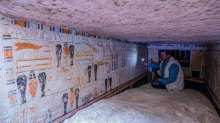 An archaeologist speaks to members of the media on Saturday, inside the tomb of Beti, one of the five ancient Pharaonic tombs recently discovered at the Saqqara archaeological site, south of the Egyptian capital Cairo. 