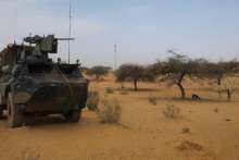 A French force armoured vehicle in Africa's Sahel region at the roadside crossing in Gossi 