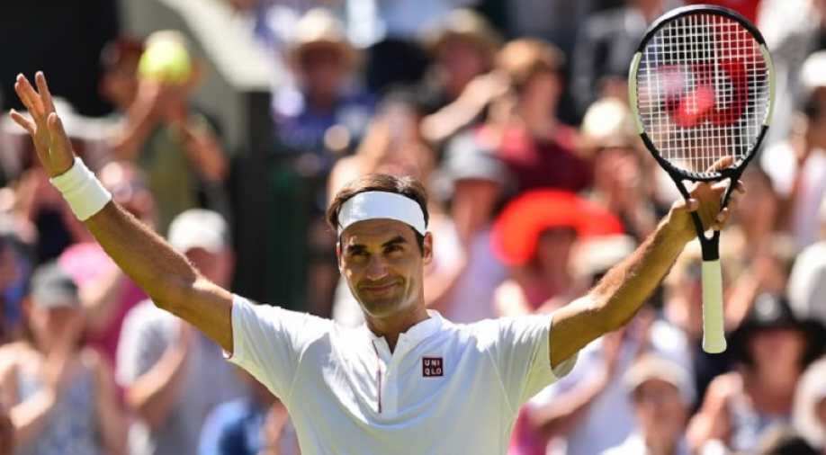 Roger Federer walks out at Wimbledon in Uniqlo shirt, not ...