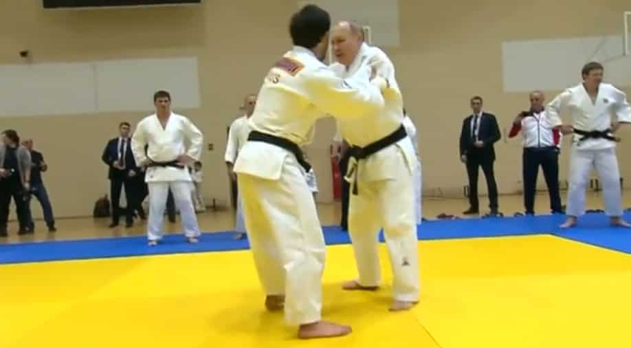 Russian President Vladimir Putin demonstrates black belt judo skills