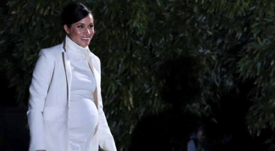 Charlie Hebdo stokes controversy by depicting Meghan ...