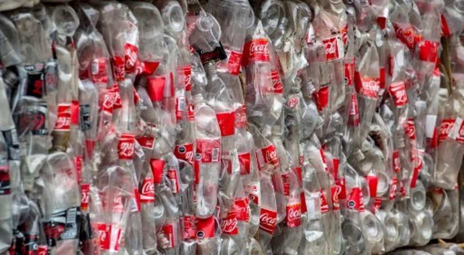 Plastic bottles versus aluminium cans Who'll win the global water