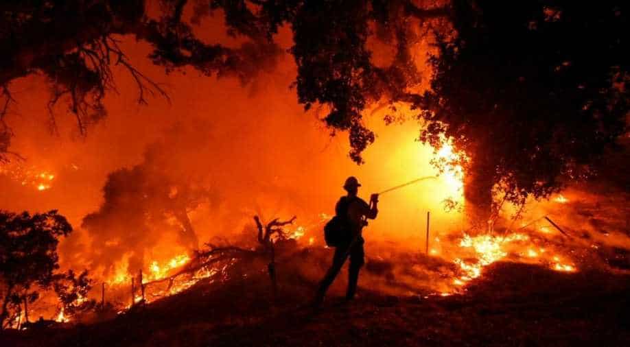 Thousands evacuated as California wildfires double in size, World ...