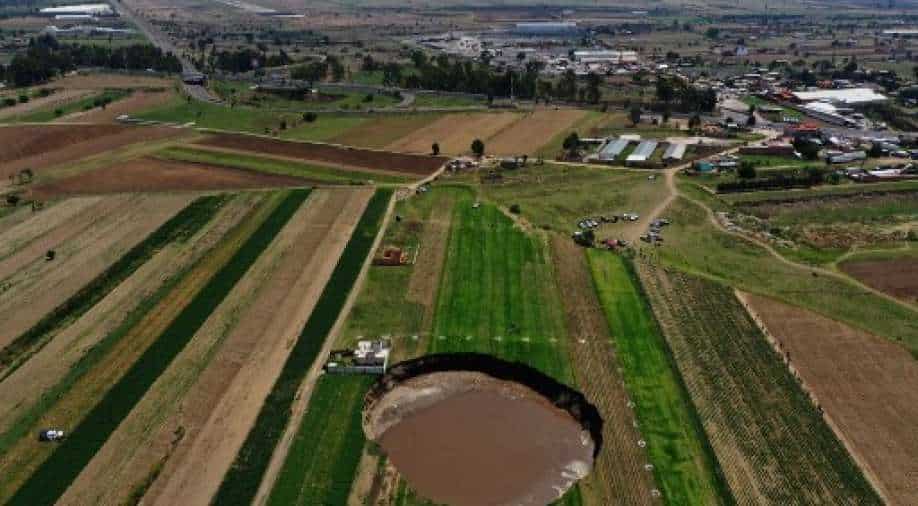 Giant sinkhole in Mexican farm threatens to swallow a house World News