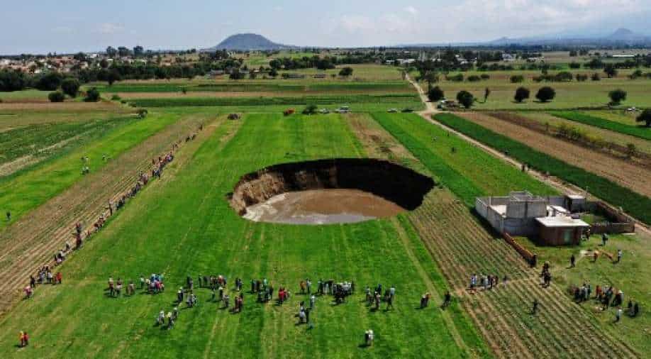 Giant sinkhole in Mexican farm threatens to swallow a house World News
