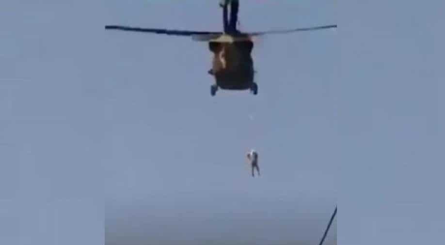 Viral video: Taliban pilot a US Black Hawk helicopter with a body hanging from it, South Asia News | wionews.com
