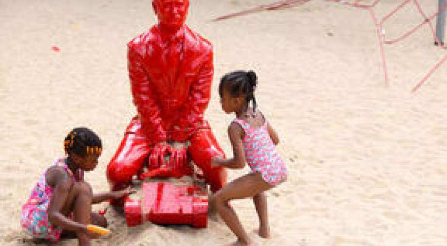 In pics Red Vladimir Putin statue appears in Central Park, leaves