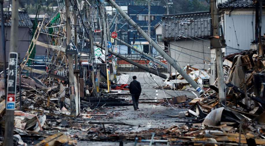 Death toll in Japan earthquake reaches 126 as harsh weather conditions hamper rescue efforts