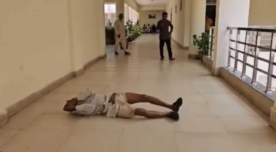 Video: Indian farmer rolls on floor while protesting alleged land occupation by mafia